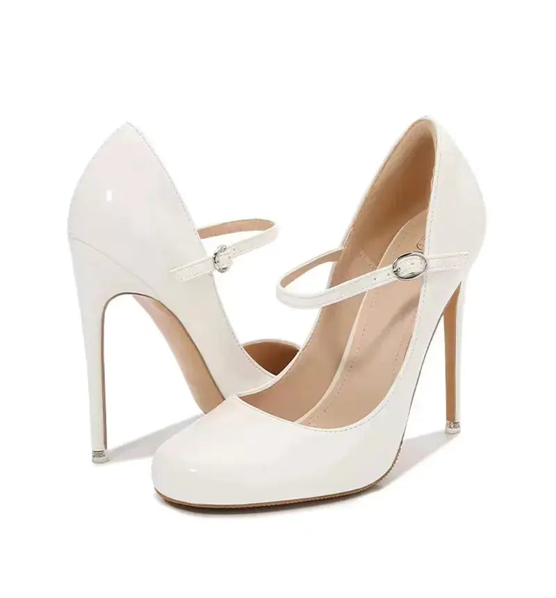 White high-heeled shoes with thin straps on a white background